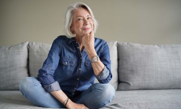 Woman sitting on couch content